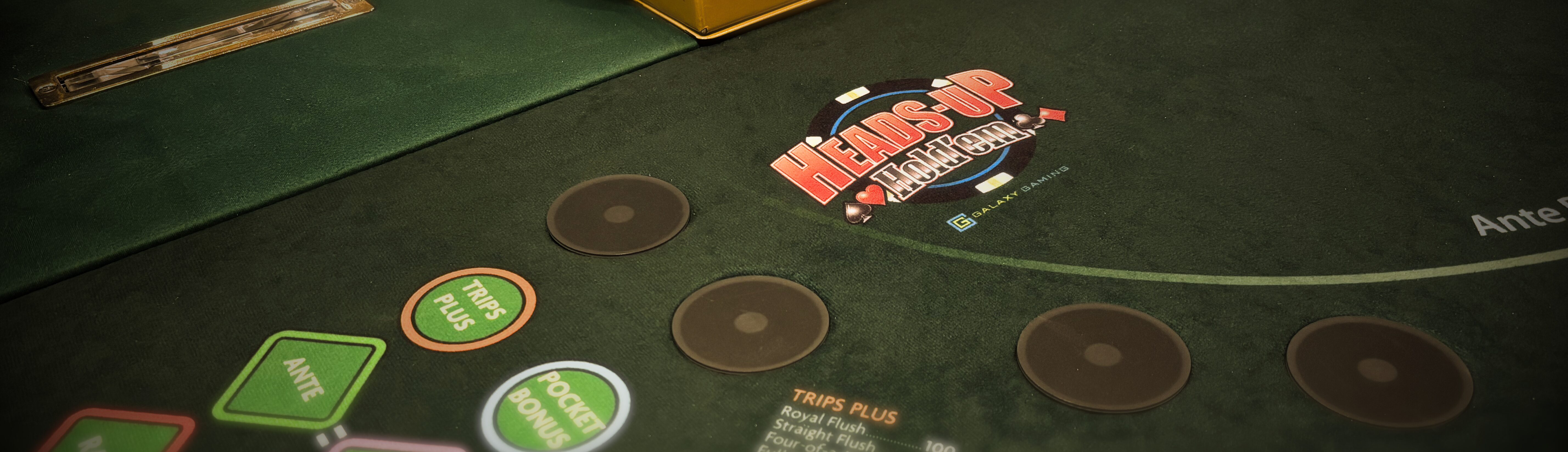 Elegant high-end casino poker table featuring Heads-Up Hold’em betting positions and luxury gaming aesthetic.